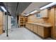 Unfinished basement with wooden cabinets, storage shelves and utility access at 3821 S Magnolia Way, Denver, CO 80237