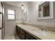 Bathroom showcasing a double vanity with tile countertops and lots of room for getting ready at 3821 S Magnolia Way, Denver, CO 80237