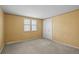 Bedroom with wall-to-wall carpeting, large windows and closet for storing belongings at 3821 S Magnolia Way, Denver, CO 80237