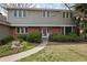 Inviting two-story home with a brick facade and a charming walkway leading to the front door at 3821 S Magnolia Way, Denver, CO 80237
