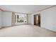 Inviting living room with neutral carpet, window seating, and classic moldings at 3821 S Magnolia Way, Denver, CO 80237
