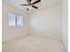 Bright bedroom with carpet, window, and ceiling fan at 18049 E 106Th Ave, Commerce City, CO 80022