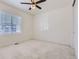 Bright bedroom with carpet, window, and ceiling fan at 18049 E 106Th Ave, Commerce City, CO 80022