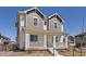 Attractive two-story home showcasing a cozy front porch and a clean, modern exterior design at 18049 E 106Th Ave, Commerce City, CO 80022