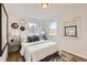 Bright bedroom features natural light, hardwood floors, and neutral paint colors at 1120 Xenia St, Denver, CO 80220