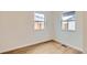 Bedroom featuring wood floors and natural light at 1120 Xenia St, Denver, CO 80220