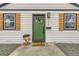 Inviting front entrance with a green door, modern hardware, and stylish shutters at 1120 Xenia St, Denver, CO 80220