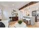 Open-concept living space showcasing a kitchen island with seating and stylish decor at 1120 Xenia St, Denver, CO 80220