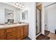 Bathroom showing vanity with dual sinks and walk-in shower at 9374 Loggia St # D, Highlands Ranch, CO 80126