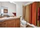 Bathroom featuring a vanity, toilet, and shower with curtain at 9374 Loggia St # D, Highlands Ranch, CO 80126