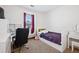 Bedroom featuring a bed, window, and desk space at 9374 Loggia St # D, Highlands Ranch, CO 80126