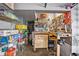Organized garage space with workbench, pegboard, storage racks and drawers at 9374 Loggia St # D, Highlands Ranch, CO 80126
