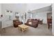 Bright and airy living room with high ceilings, plush seating, and a separate dining area at 9374 Loggia St # D, Highlands Ranch, CO 80126