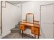 Basement landing with vanity, staircase, and a neutral carpet at 1470 Utica St, Denver, CO 80204