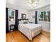 Inviting bedroom featuring hardwood floors, large windows, and stylish decor at 1470 Utica St, Denver, CO 80204