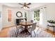 Cozy dining room with natural light, hardwood floors, and a modern chandelier at 1470 Utica St, Denver, CO 80204