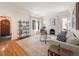 Spacious living room with hardwood floors, fireplace, and bright natural light provides a cozy, inviting space at 1470 Utica St, Denver, CO 80204