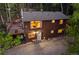 Charming home surrounded by lush greenery, featuring a well-maintained exterior and inviting entrance at 375 Castlewood Dr, Evergreen, CO 80439