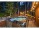 Inviting hot tub nestled in a serene outdoor setting, perfect for relaxation and entertainment at 375 Castlewood Dr, Evergreen, CO 80439