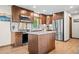 Stylish kitchen with modern appliances, an island, custom cabinetry, and an inviting layout at 375 Castlewood Dr, Evergreen, CO 80439