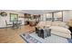 Open-concept living area seamlessly blending with the kitchen, featuring modern amenities and comfortable seating at 375 Castlewood Dr, Evergreen, CO 80439