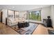 Serene living room featuring a fireplace, picturesque views, and stylish decor for relaxation and comfort at 375 Castlewood Dr, Evergreen, CO 80439