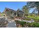 Cozy home with inviting deck and lush greenery at 3800 Lakota Rd, Indian Hills, CO 80454