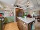 Lovely kitchen with an island, granite countertops, stainless steel appliances, and ample cabinet space at 3800 Lakota Rd, Indian Hills, CO 80454