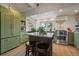 Spacious kitchen featuring an island, stainless steel appliances, open shelving, and recessed lighting at 3800 Lakota Rd, Indian Hills, CO 80454