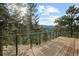 Deck overlooking scenic mountain views at 6954 Granite Crag Cir, Evergreen, CO 80439