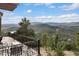 Deck with mountain views and chairs at 6954 Granite Crag Cir, Evergreen, CO 80439