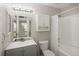 Clean bathroom featuring a shower-tub combo, neutral tones, and medicine cabinet at 1960 S Xanadu Way # 208, Aurora, CO 80014