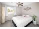 Bright bedroom with a queen-size bed and window view at 1960 S Xanadu Way # 208, Aurora, CO 80014
