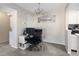 Small dining area with a glass desk and chair at 1960 S Xanadu Way # 208, Aurora, CO 80014