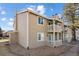 Tan two-story building with balconies and landscaping at 1960 S Xanadu Way # 208, Aurora, CO 80014