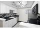Modern galley kitchen with stainless steel appliances at 1960 S Xanadu Way # 208, Aurora, CO 80014