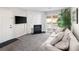 Cozy living room with a fireplace, sliding door to the patio, and comfortable seating for relaxation and entertainment at 1960 S Xanadu Way # 208, Aurora, CO 80014