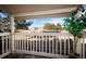 Covered patio showcasing neighborhood view with surrounding trees and lawn, offering an inviting outdoor area at 1960 S Xanadu Way # 208, Aurora, CO 80014