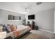 Cozy bedroom with ceiling fan, neutral paint, carpet and built-in desk area at 4570 S Kalispell Way, Aurora, CO 80015