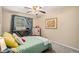 Neutral bedroom with a musical keyboard and a ceiling fan at 4570 S Kalispell Way, Aurora, CO 80015