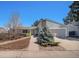 Charming single-Gathering home featuring a landscaped front yard and attached two-car garage at 4570 S Kalispell Way, Aurora, CO 80015