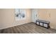 Bright entryway with wood floors, a storage bench, and a decorative front door at 4570 S Kalispell Way, Aurora, CO 80015