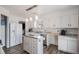 Clean, modern kitchen with white cabinetry and stainless steel appliances at 4570 S Kalispell Way, Aurora, CO 80015