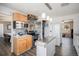 Bright kitchen featuring wood cabinets, an island, stainless steel appliances and mosaic tile backsplash at 4570 S Kalispell Way, Aurora, CO 80015