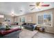 Spacious living room features hardwood floors, bright windows, and stylish, comfortable seating at 4570 S Kalispell Way, Aurora, CO 80015