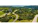 Expansive aerial view of a beautiful home nestled within lush greenery and rolling hills at 4320 Stone Post Dr, Castle Rock, CO 80108
