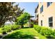 Manicured backyard featuring a deck, patio, and lush lawn with landscaping at 4320 Stone Post Dr, Castle Rock, CO 80108