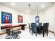 Finished basement space with a pub table and other seating at 4320 Stone Post Dr, Castle Rock, CO 80108