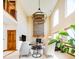Bright living room with vaulted ceilings, stone fireplace, and modern chandelier at 4320 Stone Post Dr, Castle Rock, CO 80108
