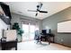 Well-lit home office with natural light, a ceiling fan, and a modern desk setup at 4320 Stone Post Dr, Castle Rock, CO 80108